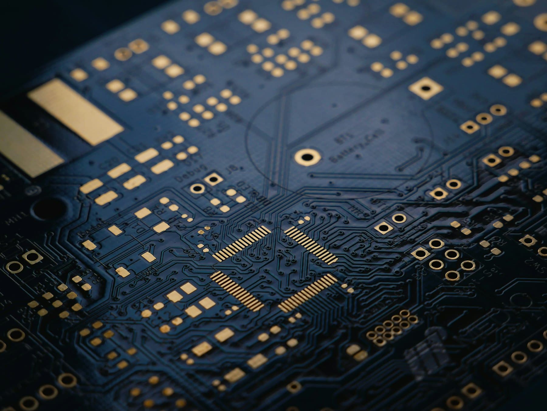 Printed circuit board macro with trace routing and vias.