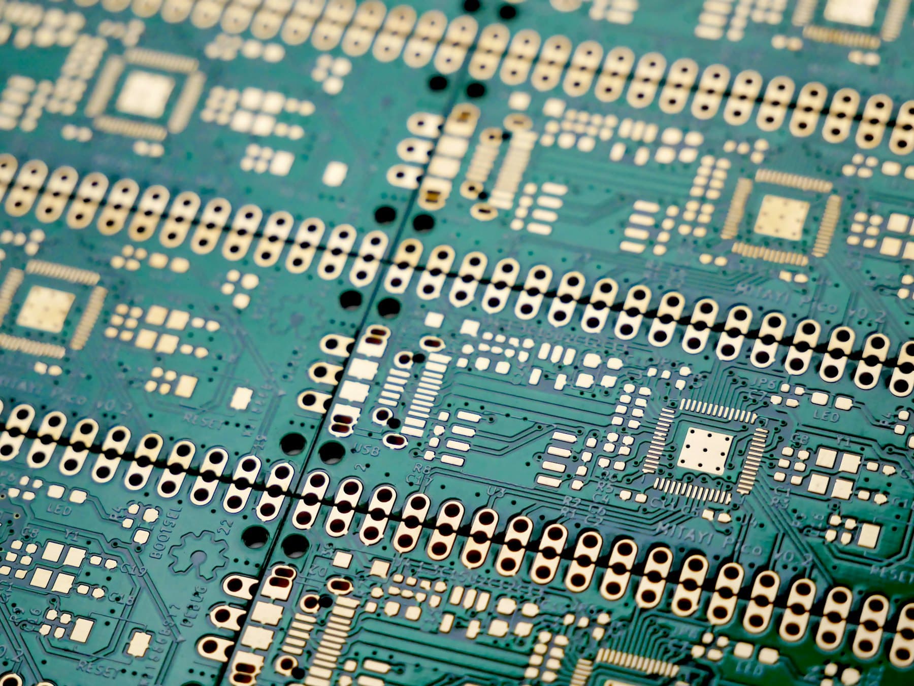 Panel of printed circuit boards at close range.